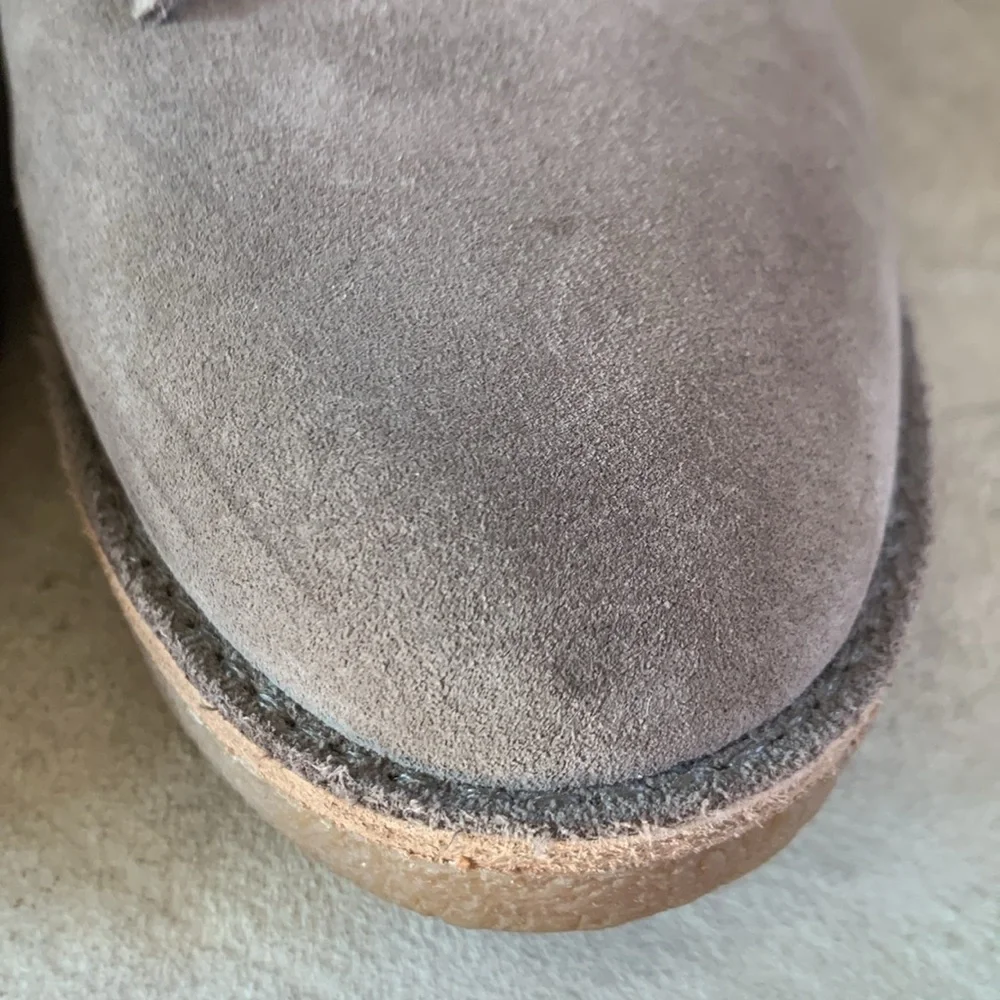 UGG sz 9 taupe heeled booties with front fringe and rubber heel